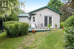 Back deck overlooks gardens and sunsets -