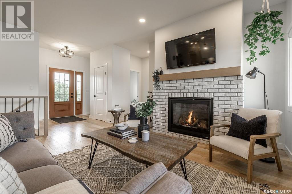 10 Applewood Place, Corman Park Rm No. 344, SK - Indoor Photo Showing Living Room With Fireplace