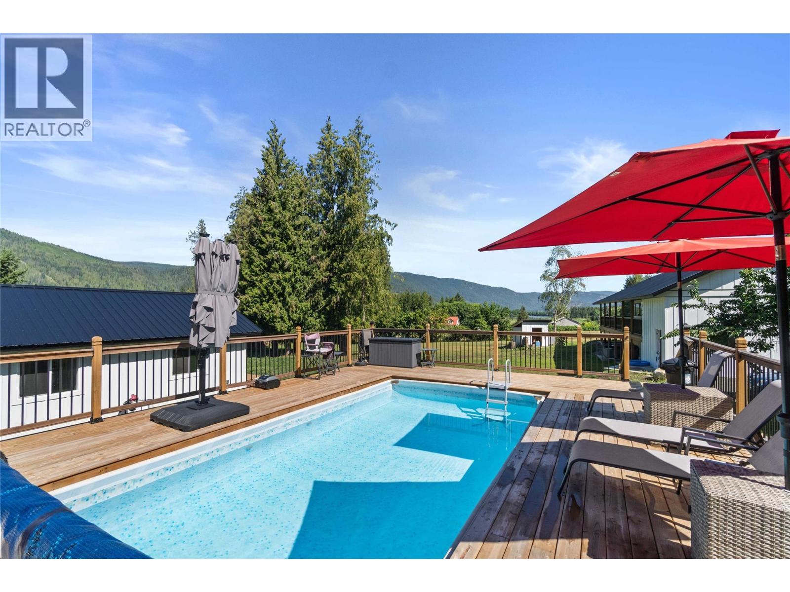 22 Parsons Road, Mara, BC - Outdoor With In Ground Pool With Deck Patio Veranda
