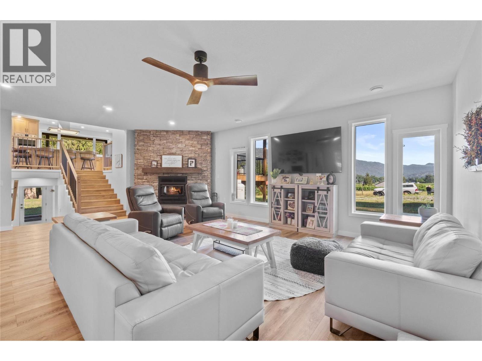 22 Parsons Road, Mara, BC - Indoor Photo Showing Living Room With Fireplace
