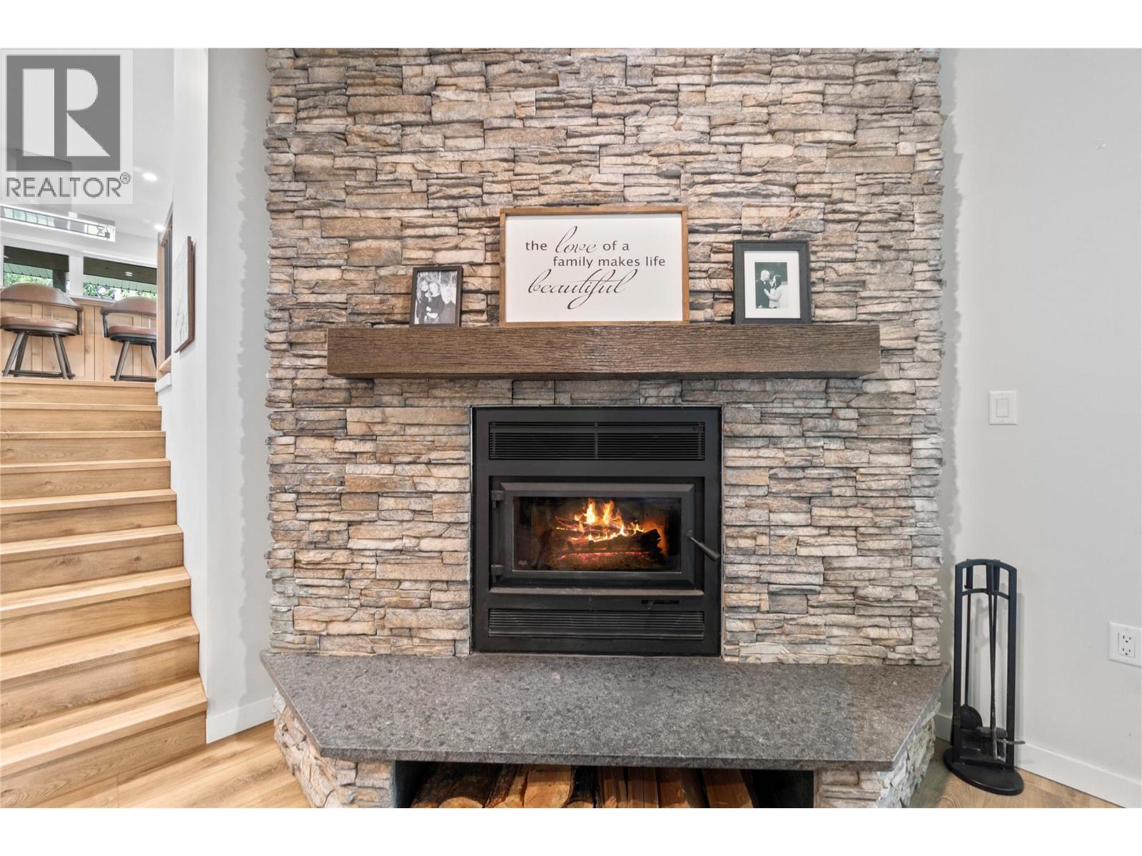 Wood Insert - 22 Parsons Road, Mara, BC - Indoor Photo Showing Living Room With Fireplace