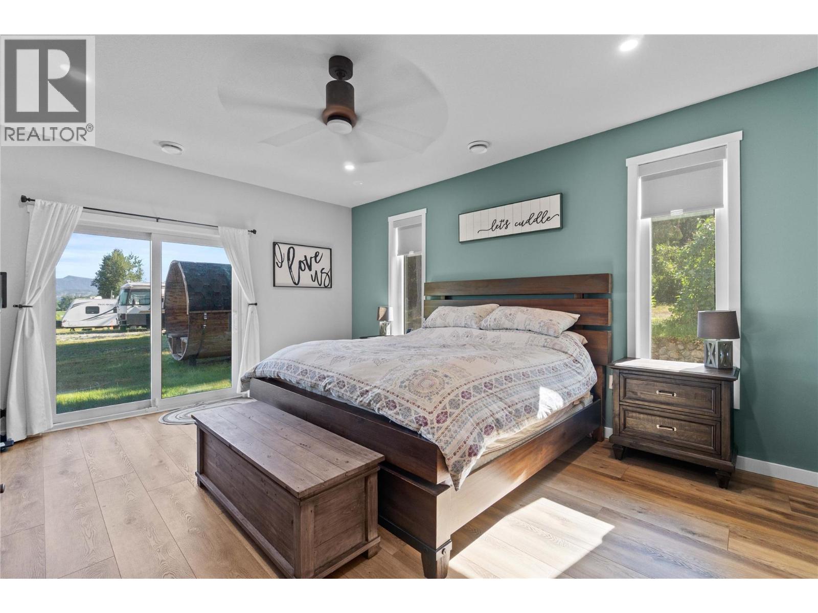 Primary Bedroom - 22 Parsons Road, Mara, BC - Indoor Photo Showing Bedroom