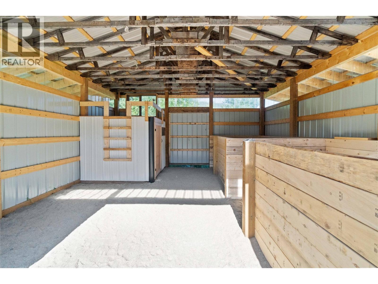 Stalls/Tac Room - 22 Parsons Road, Mara, BC - Indoor Photo Showing Garage