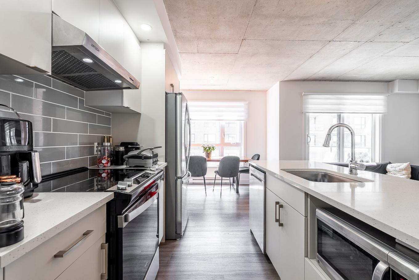 Overall view - 504-1431 Av. De La Gare, Mascouche, QC - Indoor Photo Showing Kitchen With Upgraded Kitchen