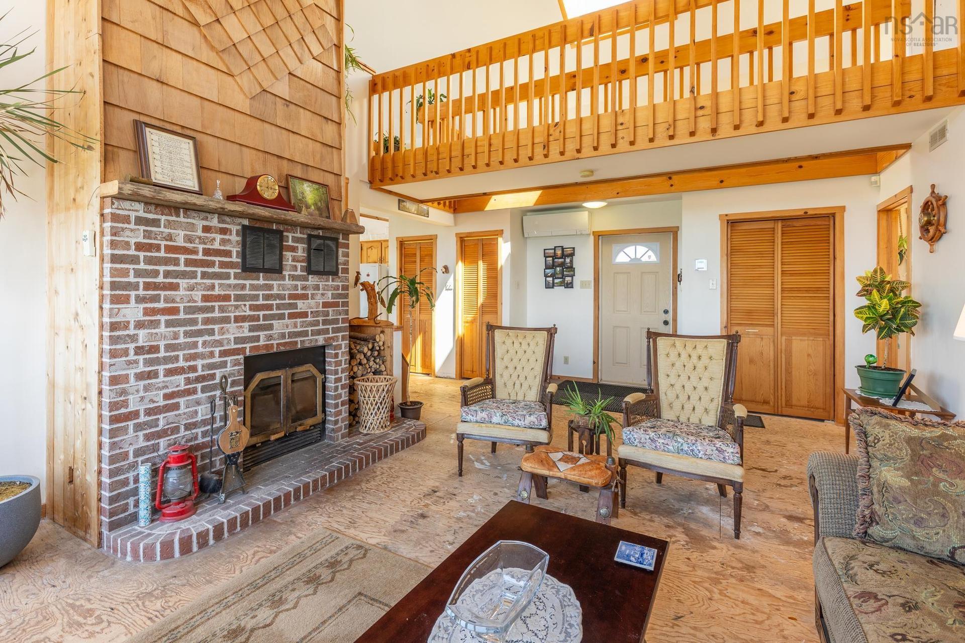 194 Thomas Road, Cape Forchu, NS - Indoor Photo Showing Living Room With Fireplace