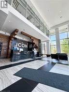 Reception area featuring wood walls and a towering ceiling -