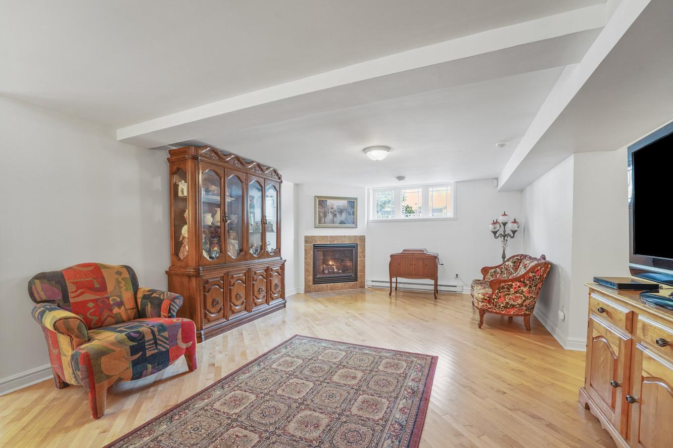 Intergénération - 22 Rue Des Doublons, Blainville, QC - Indoor Photo Showing Living Room With Fireplace