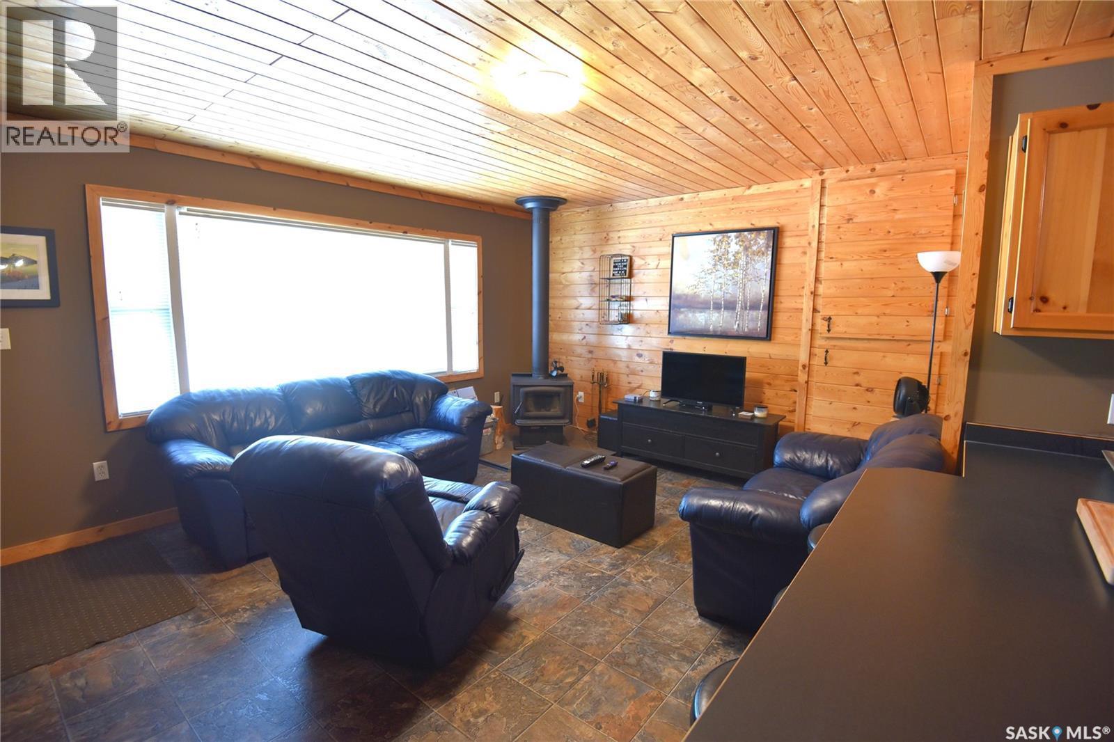 217 Birch Drive, Tobin Lake, SK - Indoor Photo Showing Living Room With Fireplace