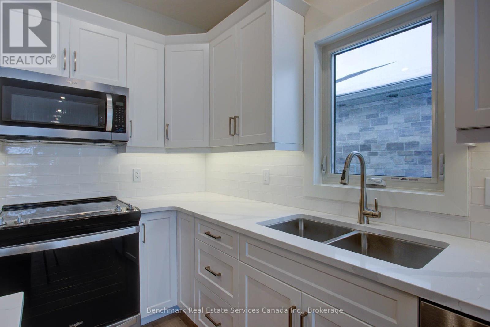 63 Cavalier Crescent, Huron-Kinloss, ON - Indoor Photo Showing Kitchen With Double Sink With Upgraded Kitchen