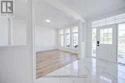 Front Hall with Upgraded Floors O/L Dining Room -