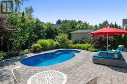 Stone around the pool for easy maintenance -