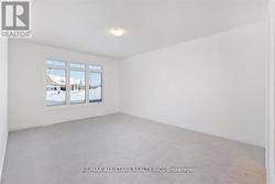 Primary Bedroom with Broadloom Floors -