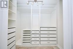 PRIMARY WALK IN CLOSET -