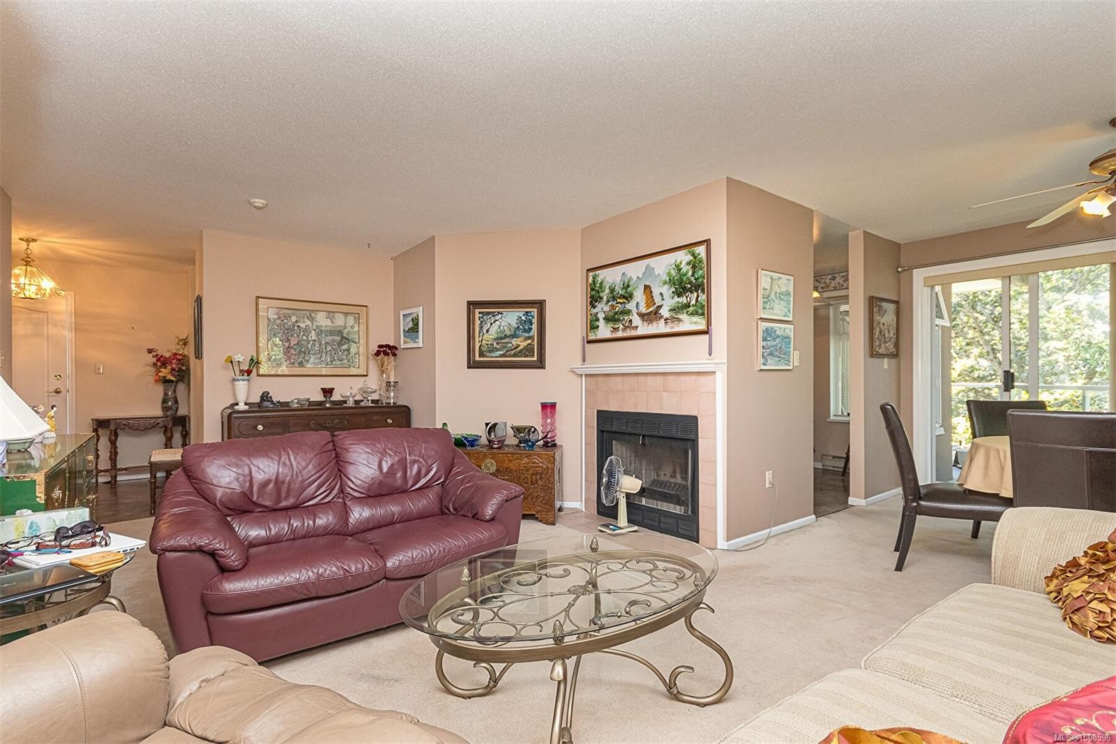 303C-4678 Elk Lake Dr, Saanich, BC - Indoor Photo Showing Living Room With Fireplace