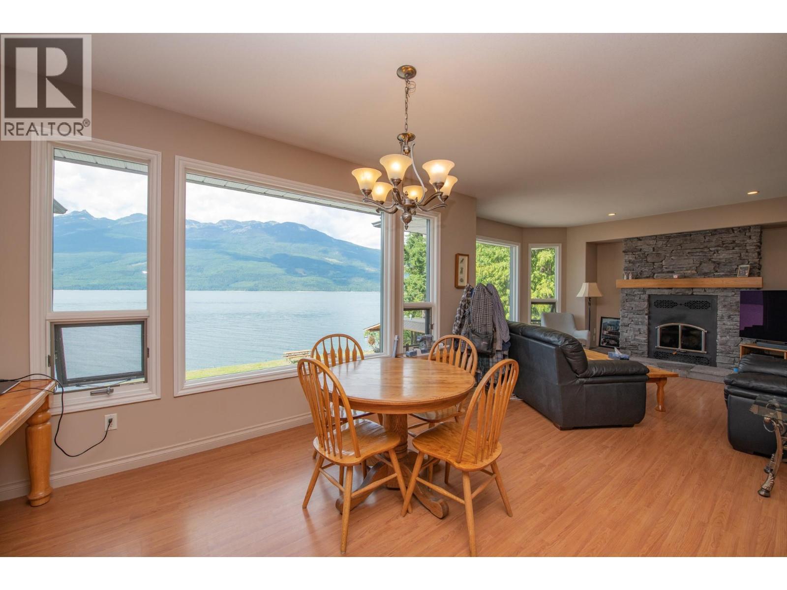 1710 6 Highway, Nakusp, BC - Indoor Photo Showing Dining Room With Fireplace