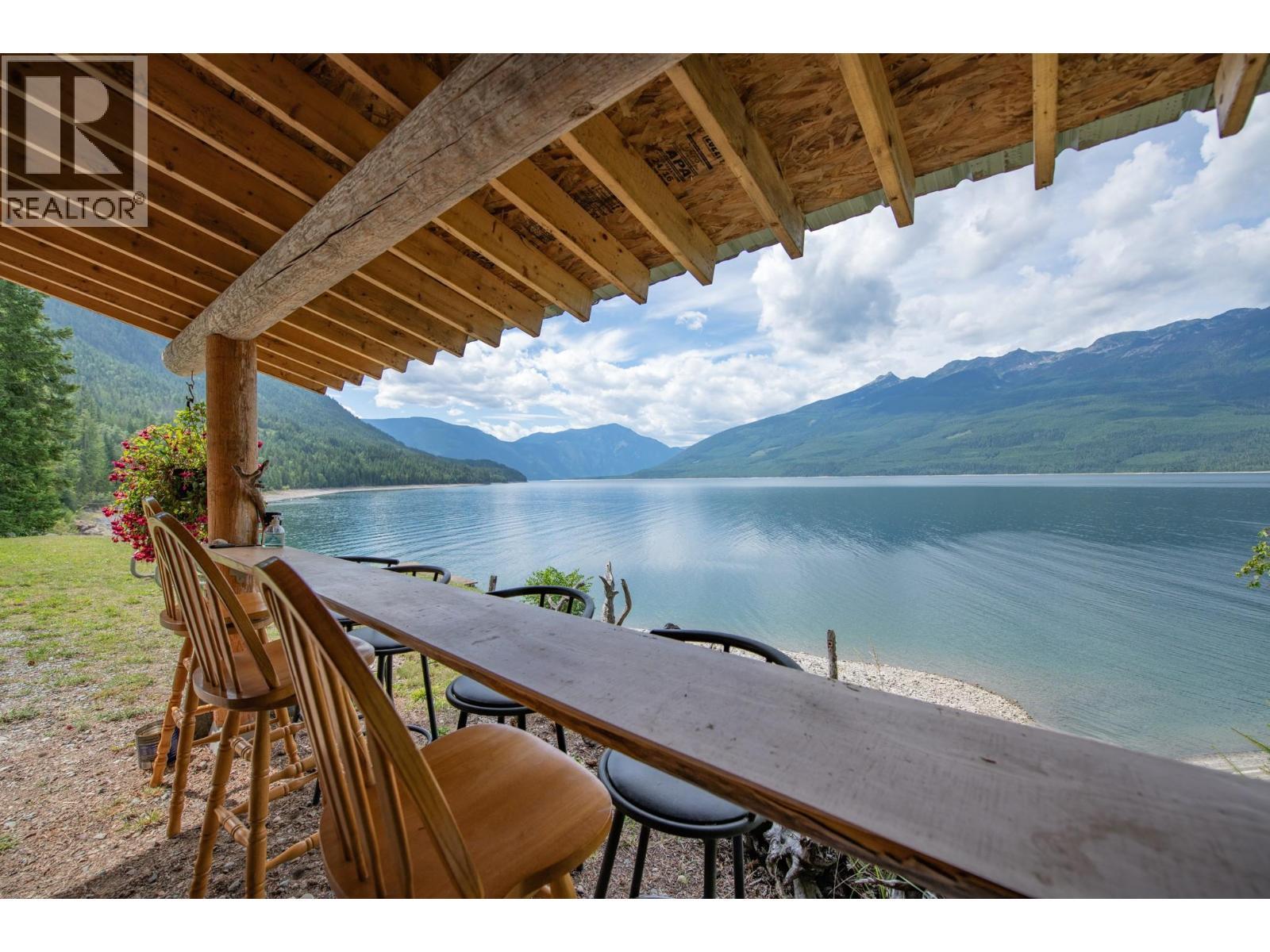 Along the shores of Arrow Lake - 1710 6 Highway, Nakusp, BC - Outdoor With Body Of Water With Deck Patio Veranda With View