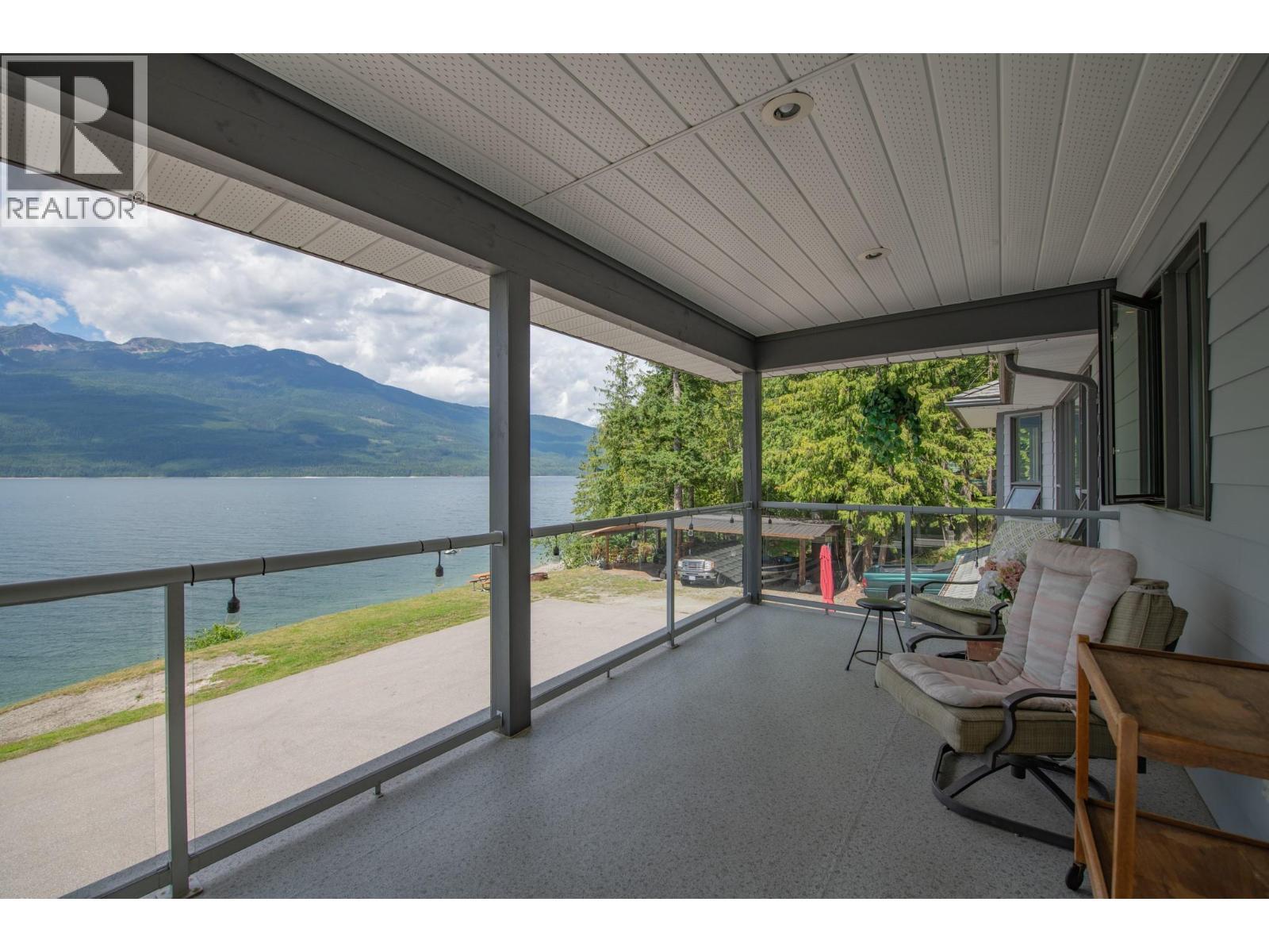 1710 6 Highway, Nakusp, BC - Outdoor With Body Of Water With Deck Patio Veranda With Exterior