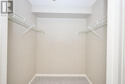 Primary bedroom walk in closet -