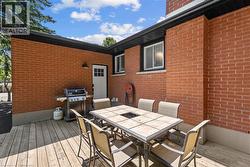 Deck with outdoor dining space and area for grilling -