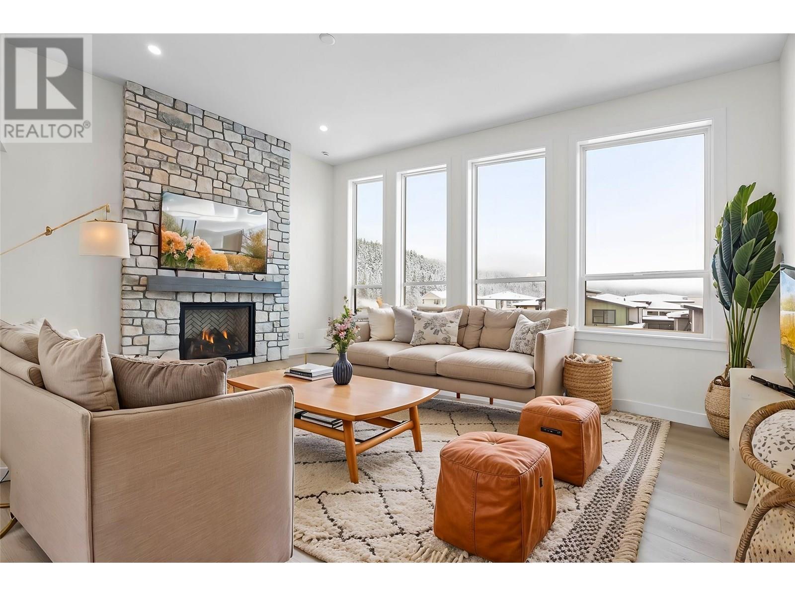 This photo has been virtually staged! - 1294 Brechin Place, Kamloops, BC - Indoor Photo Showing Living Room With Fireplace