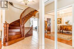 HALLWAY WITH CUSTOM OAK STAIRS, OPEN TO BELOW. -