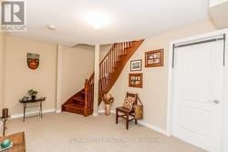 CUSTOM OAK STAIRS OPEN TO BASEMENT LANDING. -