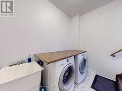 Main Floor Laundry room includes a sink -