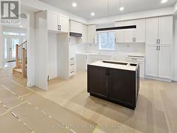 Custom kitchen. Countertops installed soon. -