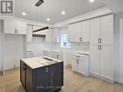 Custom kitchen. Countertops installed soon. -