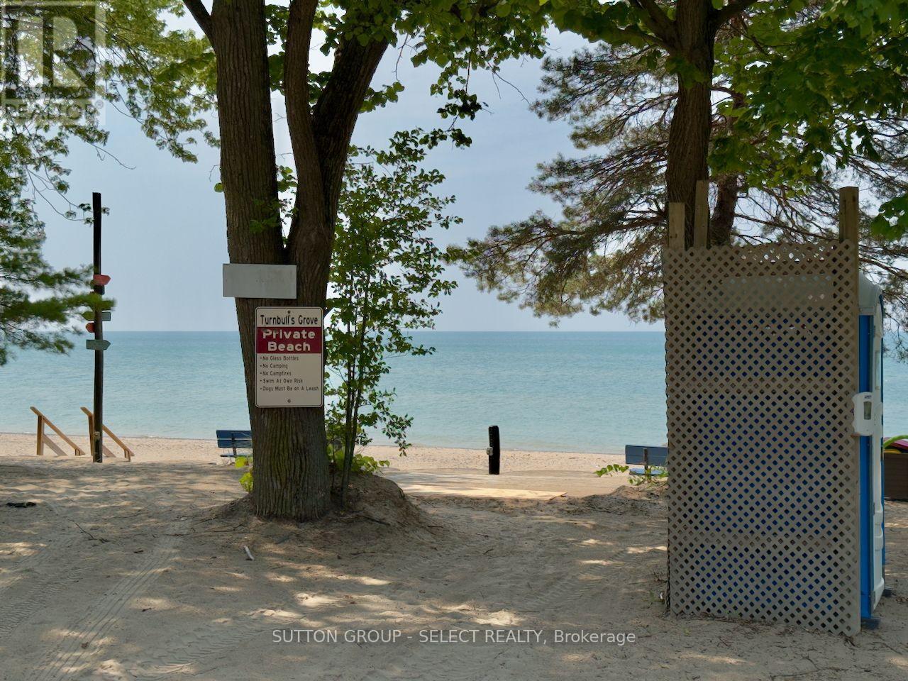 10 Caribbean Lane, Bluewater (Dashwood), ON - Outdoor With Body Of Water With Deck Patio Veranda With View