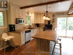 Kitchen with view of door to access the deck -