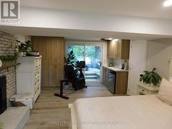 Primary bedroom on lower level/ with walk out to r -