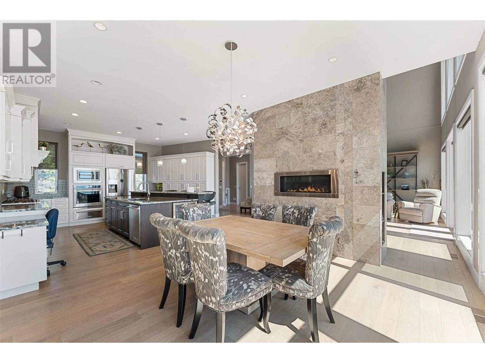 1579 Pritchard Drive, West Kelowna, BC - Indoor Photo Showing Dining Room With Fireplace