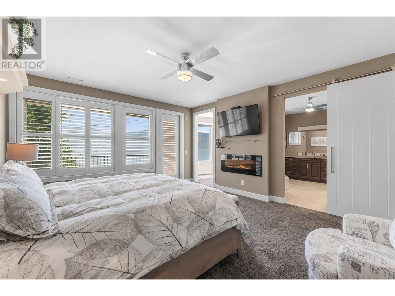 1579 Pritchard Drive, West Kelowna, BC - Indoor Photo Showing Bedroom With Fireplace