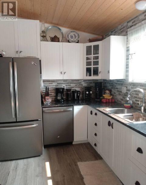 56 Sukunka Place, Tumbler Ridge, BC - Indoor Photo Showing Kitchen With Double Sink
