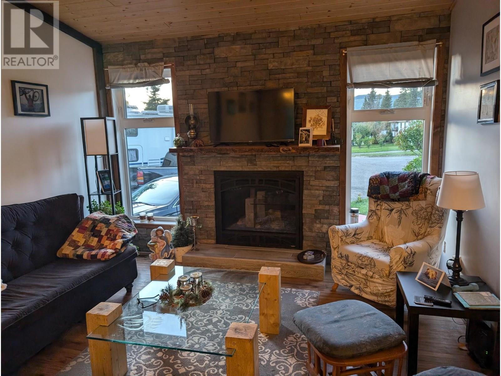 56 Sukunka Place, Tumbler Ridge, BC - Indoor Photo Showing Living Room With Fireplace