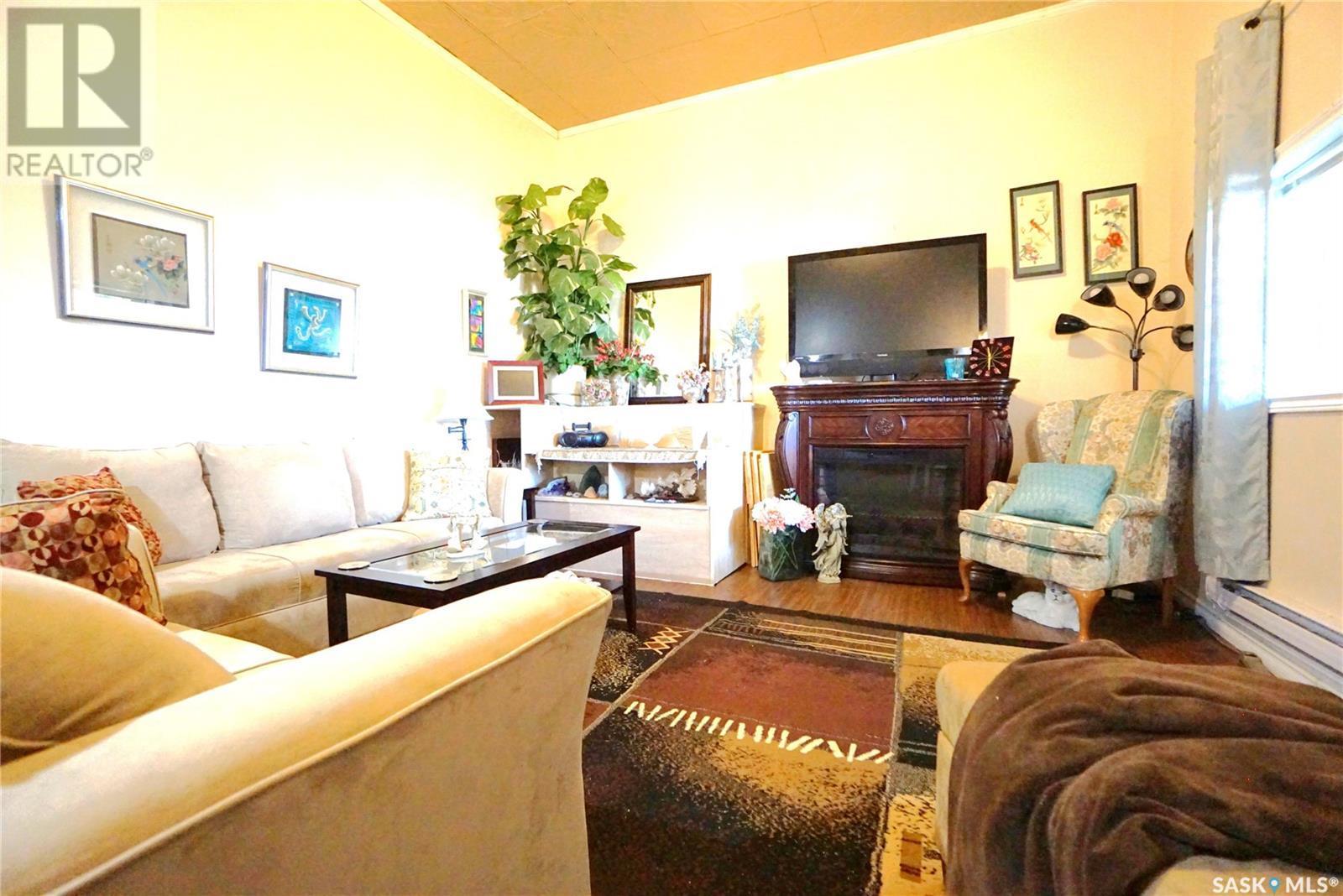 116 Main Street, Avonlea, SK - Indoor Photo Showing Living Room With Fireplace