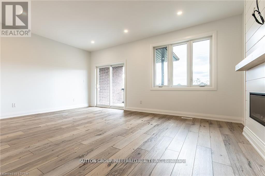 28 - 175 Glengariff Drive, Southwold, ON - Indoor Photo Showing Other Room With Fireplace
