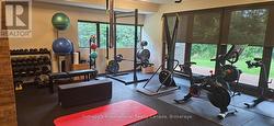 Lower level gym with 2 Peleton bikes -