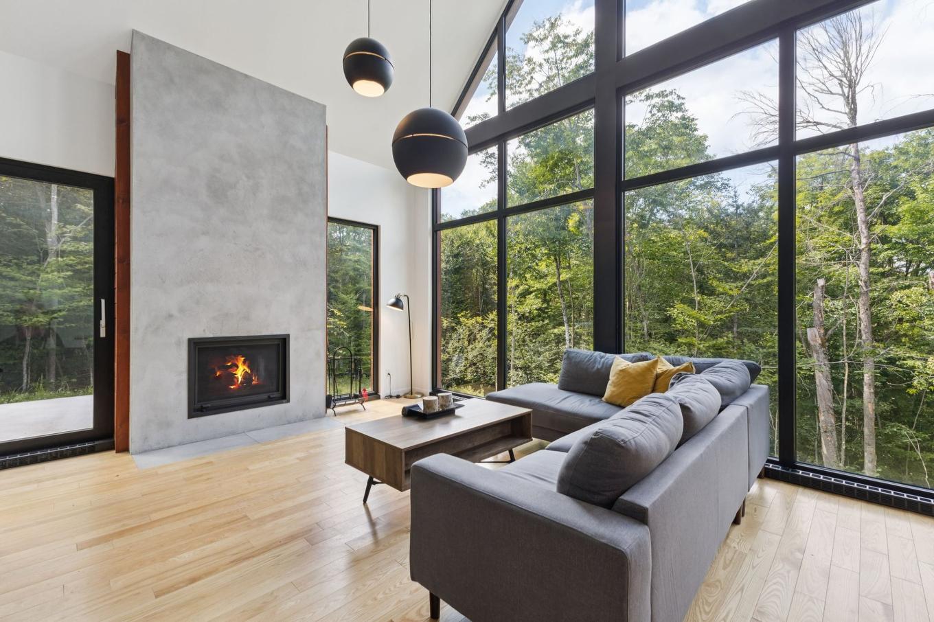 Living room - 304 - 15 Imp. Du Cardinal, Lac-Supérieur, QC - Indoor Photo Showing Living Room With Fireplace