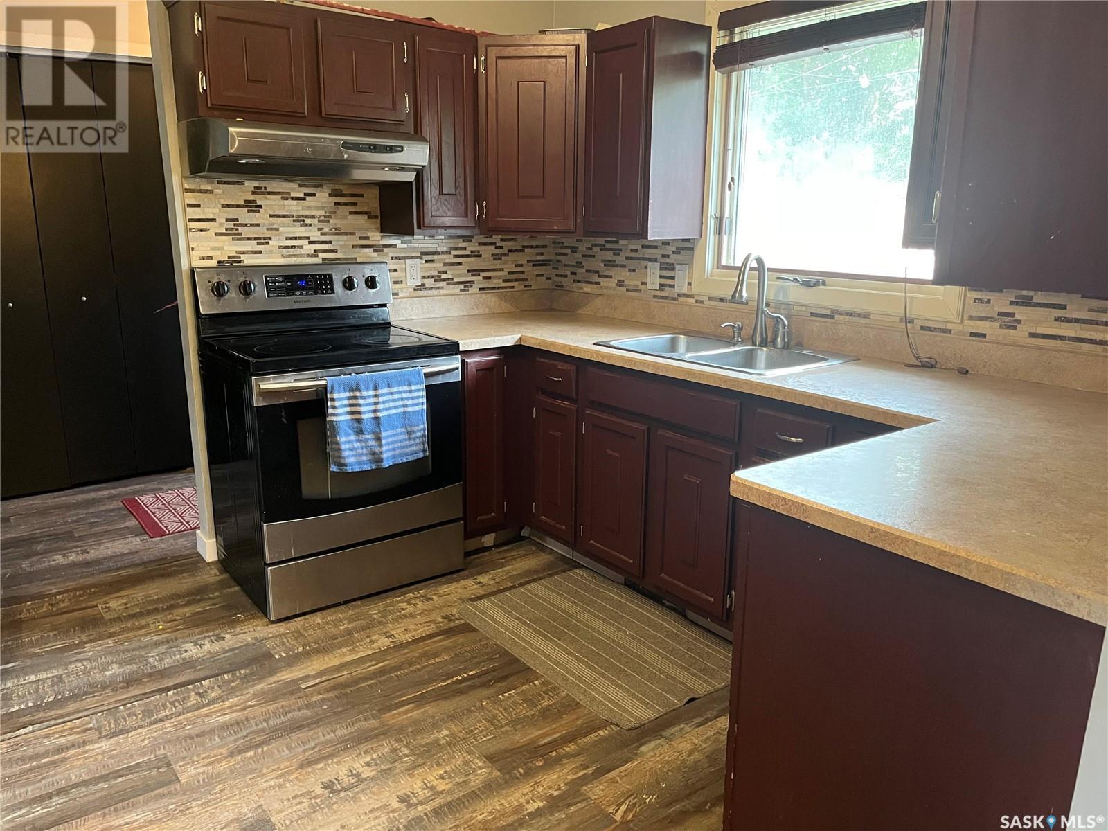 206 3Rd Avenue, Caronport, SK - Indoor Photo Showing Kitchen With Double Sink