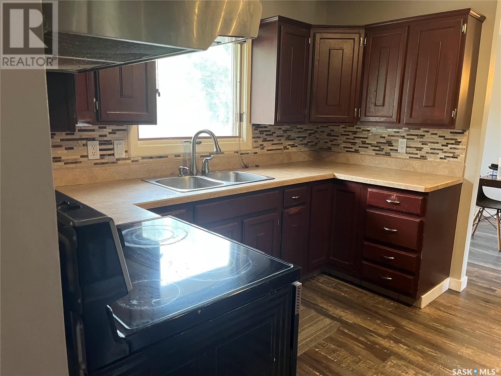 206 3Rd Avenue, Caronport, SK - Indoor Photo Showing Kitchen With Double Sink