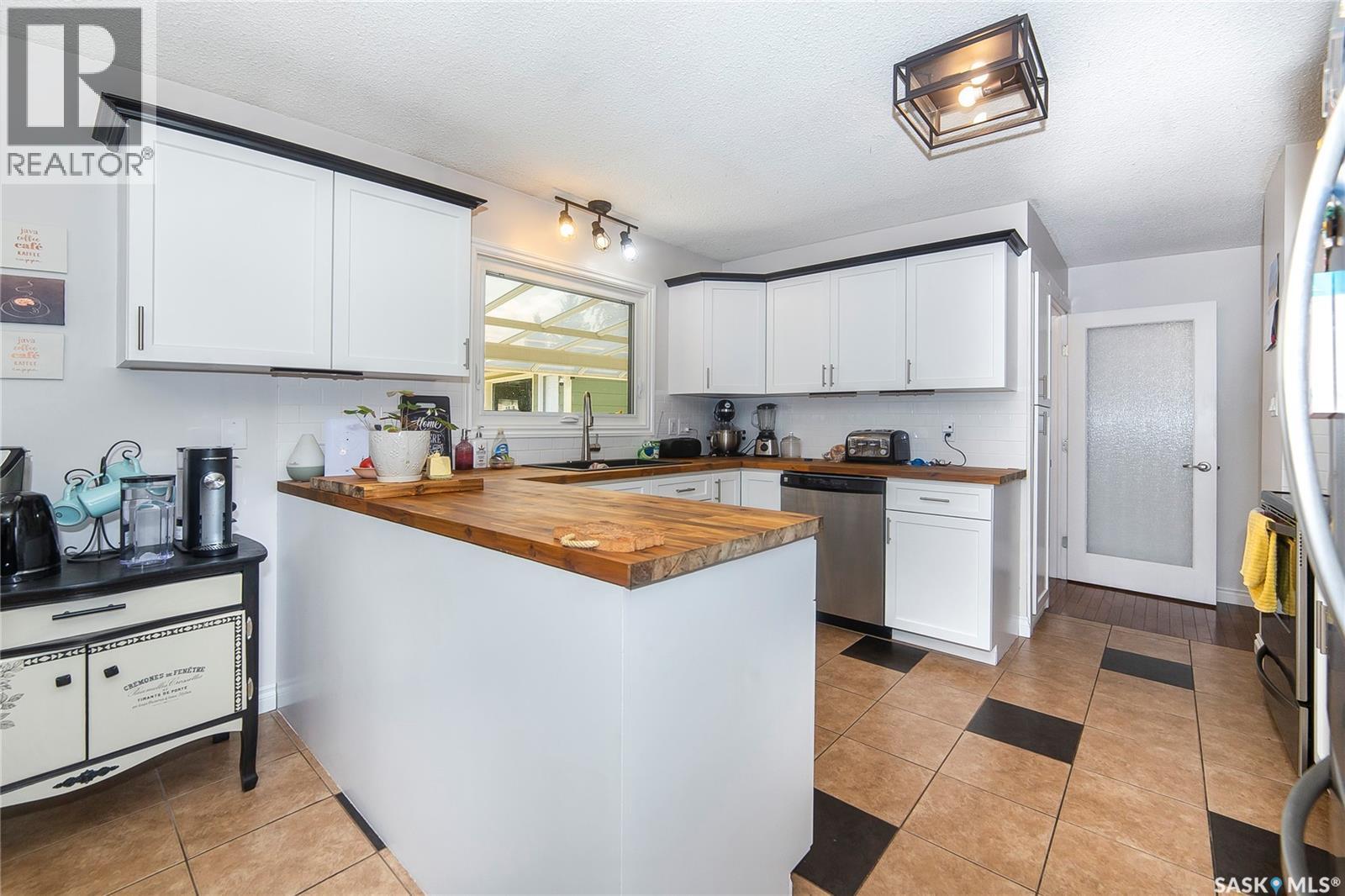 33 Birch Drive, Birch Hills, SK - Indoor Photo Showing Kitchen With Double Sink