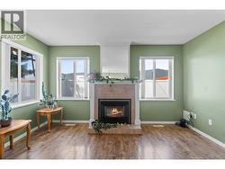 Gas Fireplace in Living Room - Windows face West -