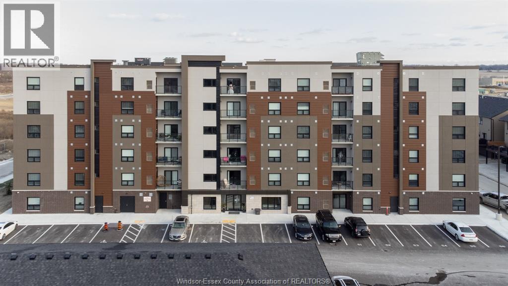 716 Brownstone Unit# 405, Tecumseh, ON - Outdoor With Balcony With Facade