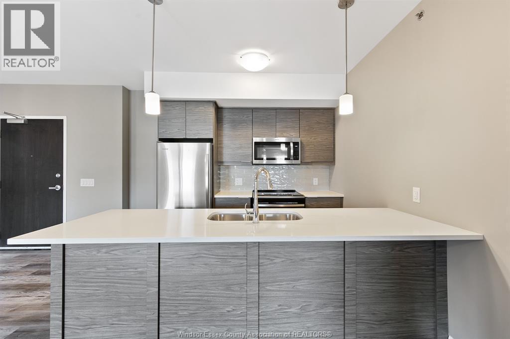 716 Brownstone Unit# 405, Tecumseh, ON - Indoor Photo Showing Kitchen With Stainless Steel Kitchen With Double Sink With Upgraded Kitchen