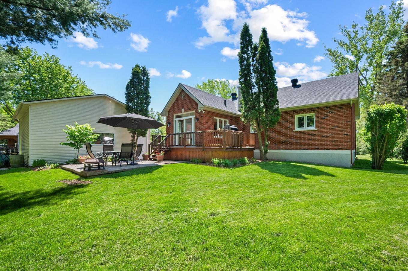 Back facade - 95 Ch. Des Quarante, Saint-Mathias-Sur-Richelieu, QC - Outdoor With Deck Patio Veranda With Exterior