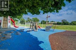 Community play area featuring a yard -