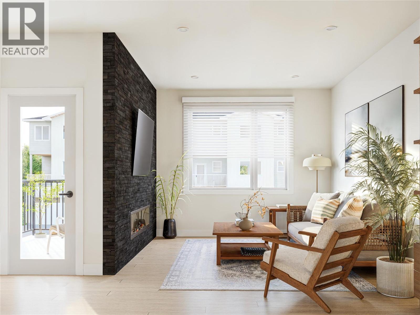222 Temple Street Unit# 4, Sicamous, BC - Indoor Photo Showing Living Room With Fireplace