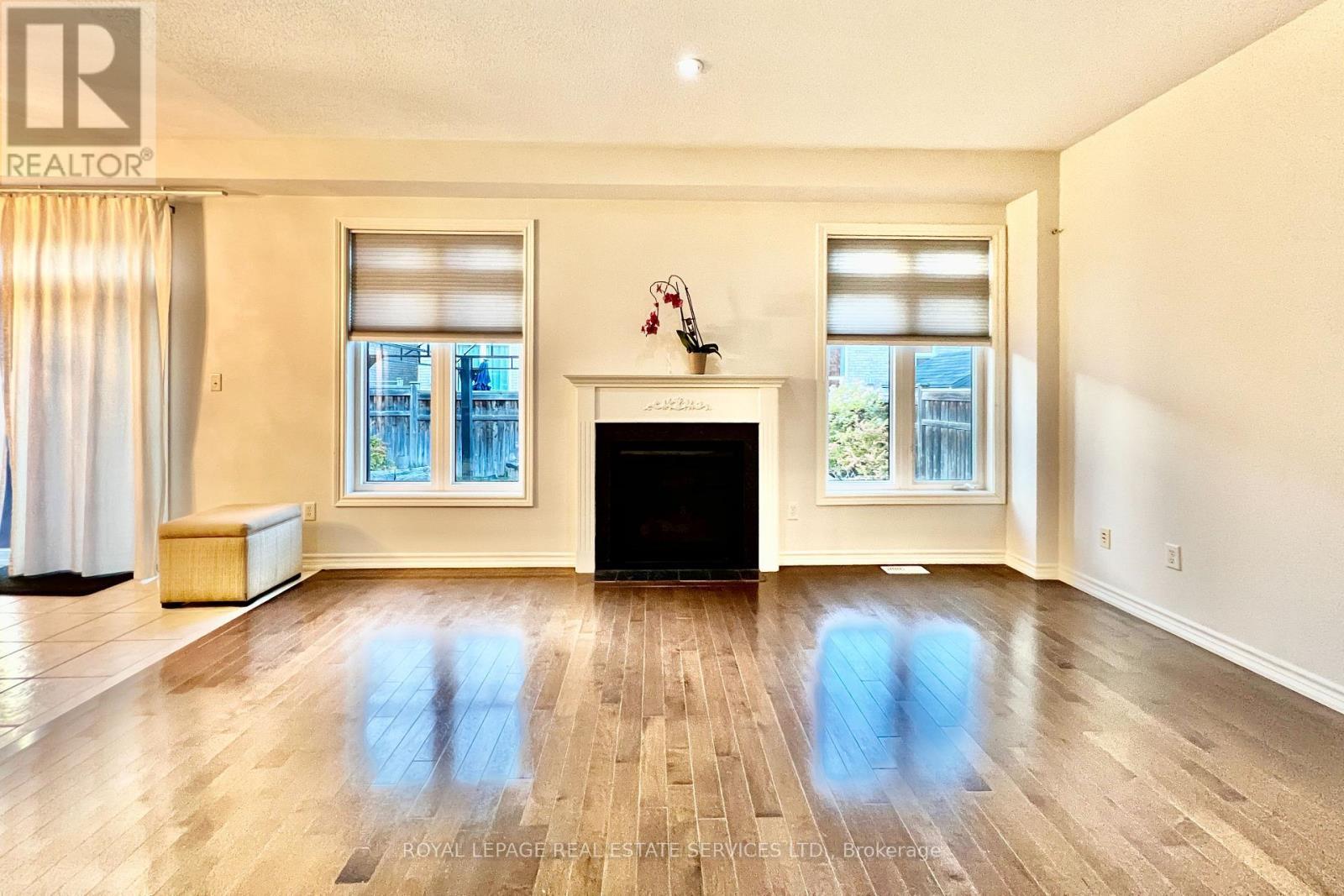 Living Room with Gas Fireplace - 4681 Webb Street, Burlington, ON - Indoor With Fireplace
